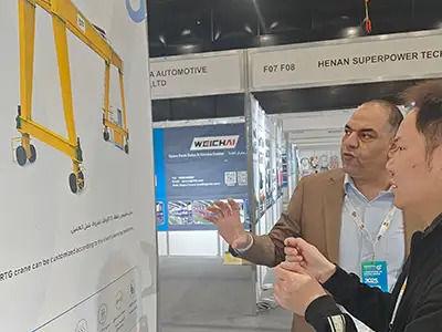 Yuantai Cranes booth attracting international buyers interested in European-style hoists, RTG cranes, and overhead crane technology.